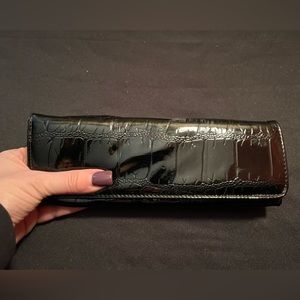 Slim, soft, long, patent leather like wallet. Money card slots, and change area
